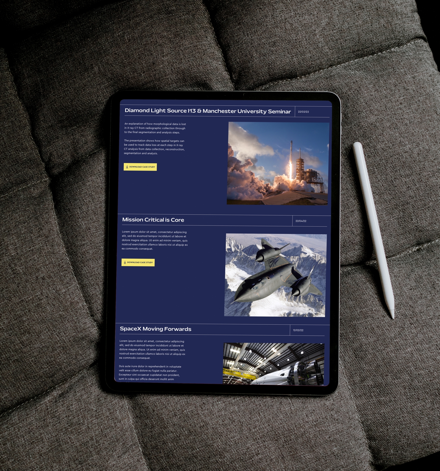 A tablet and pen sit on a cushion