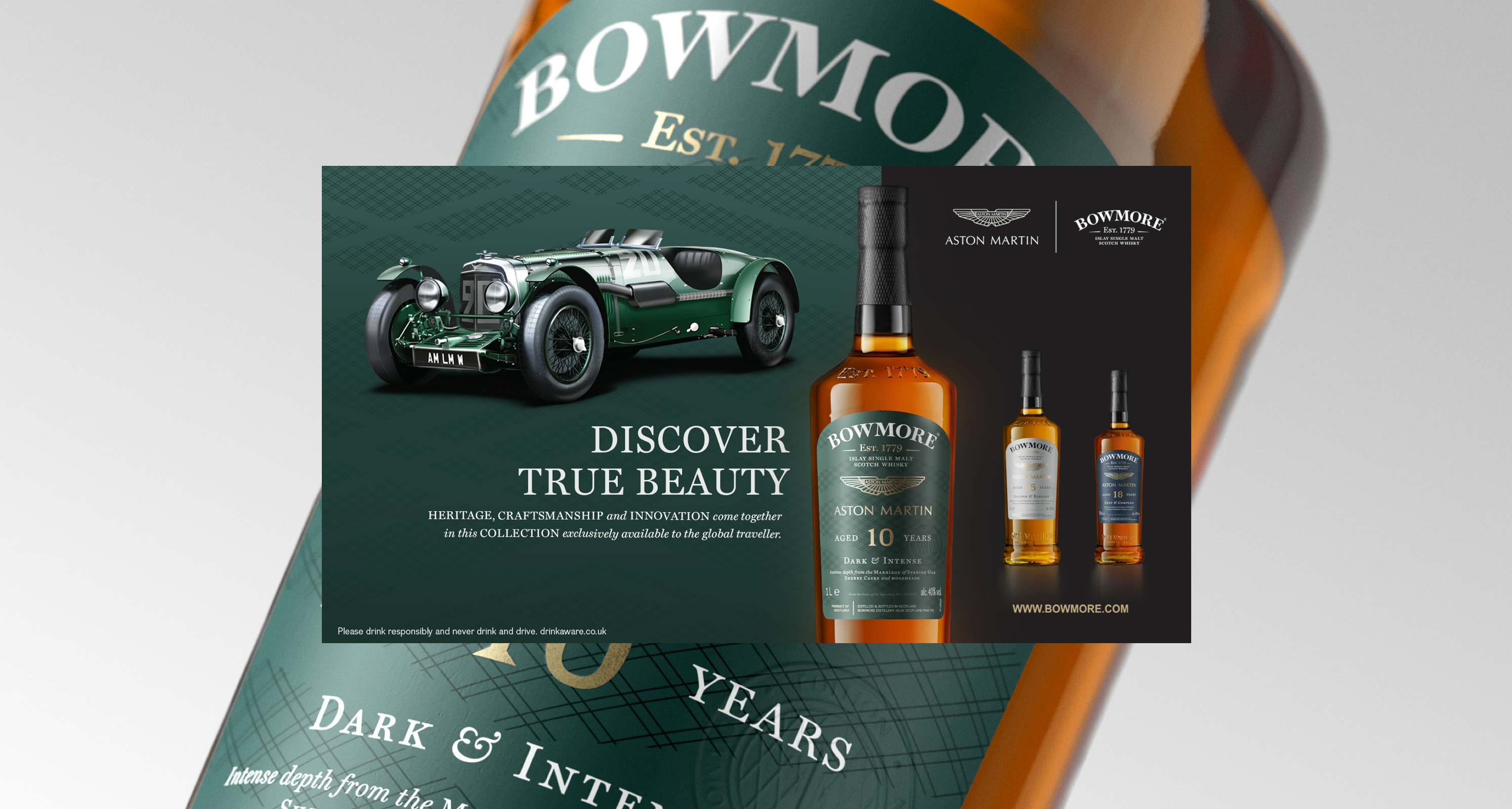 All Three Bowmore Aston Martin whisky bottles and a classic Aston Martin Le Mans Work car showcase the Bowmore Aston Martin 10 year old whisky bottle in this example print image created by More Yum. "DISCOVER TRUE BEAUTY: Heritage craftsmanship and innovation come together in this collection exclusively available to the global traveler". You can discover more at www.bowmore.com