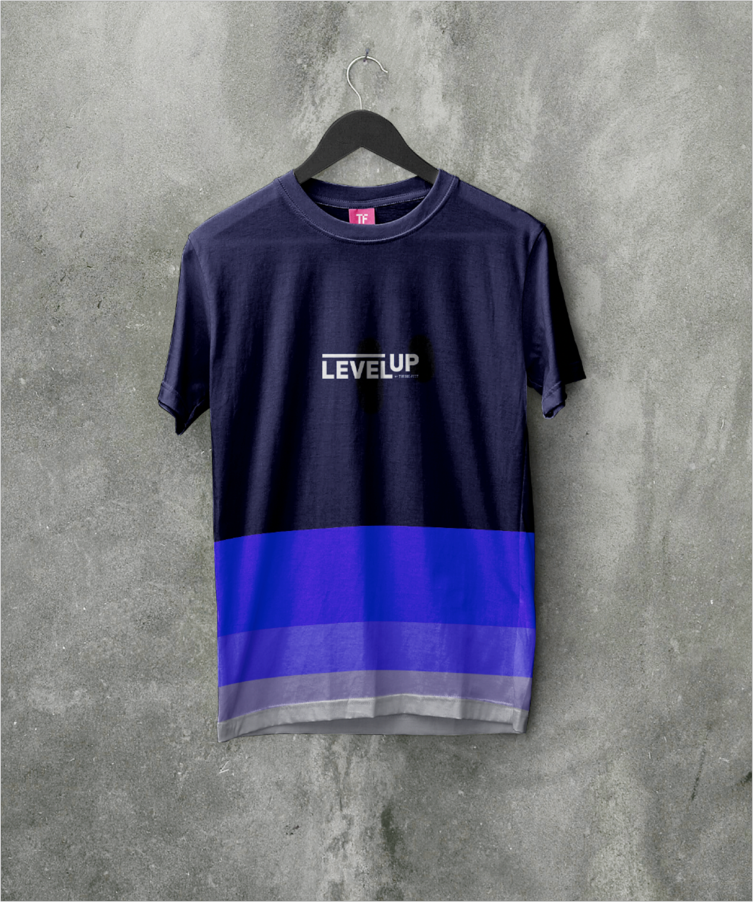 An example of promotional swag; a ‘Level Up’ t-shirt in with horizontal stripes in shades of purple
