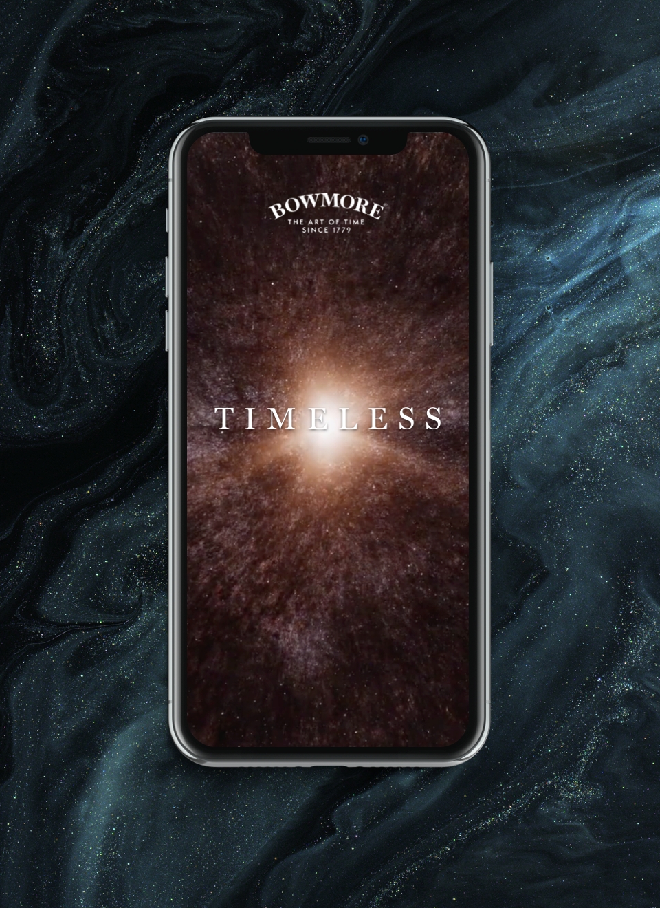 A mobile of "Bowmore Timeless" with a space background on the screen sits on a dark blue and green molten background